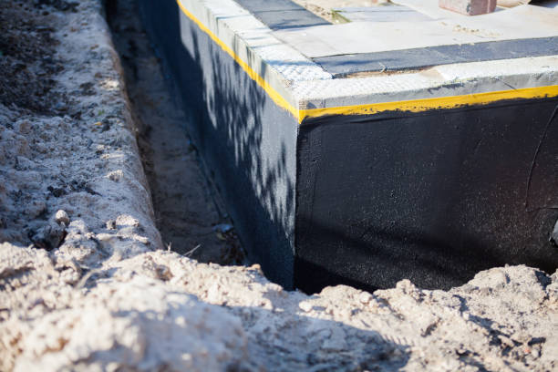 Professional Waterproofing technician working in Cold Spring Harbor, NY